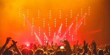 People Enjoying the Concert with smartphone in hand | GRAMHIR