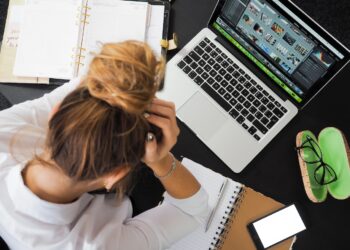 Woman Sitting in Front of Macbook | GRAMHIR