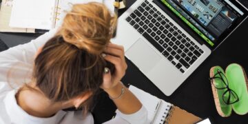Woman Sitting in Front of Macbook | GRAMHIR