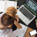 Woman Sitting in Front of Macbook | GRAMHIR