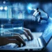 A person's hands type on a laptop keyboard. Above the keyboard, a robotic hand reaches towards a holographic interface displaying various graphs, charts, and data visualizations, symbolizing AI integration while highlighting potential AI security threats in technology. | GRAMHIR