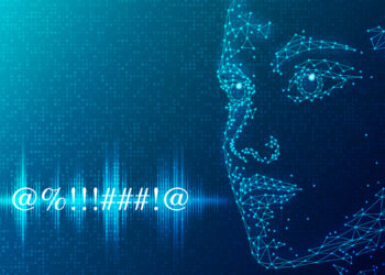 A digital, polygonal face made of interconnected blue dots and lines is shown on a dark blue background. The face appears to be gazing towards a series of abstract symbols (@%..!!##!@). Soundwave and digital binary patterns, evoking ai voice cloning technology, are visible in the background. | GRAMHIR