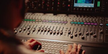 Featured image for: AI in Music Production: Tools and Workflow Integration (Detail specific AI tools for composition, mixing, and mastering. Provide a step-by-step workflow showing how to integrate AI (like AIVA) into a traditional music production process.)