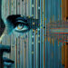 A digital artwork of a human face blended with vertical and horizontal lines, evoking the concept of artificial intelligence, data, and technology integration. The eye is prominently featured, symbolizing awareness and perception. | GRAMHIR